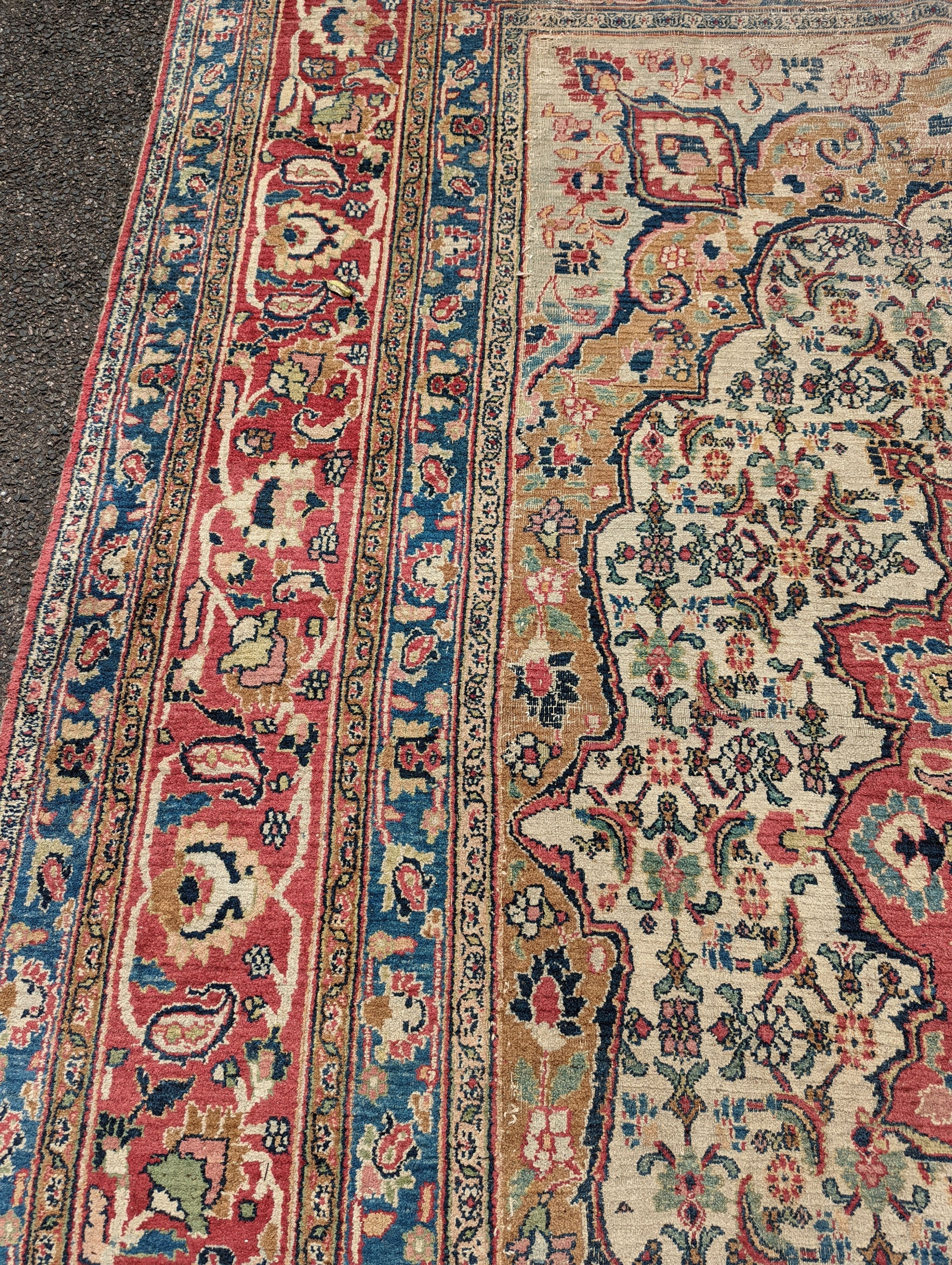An Isfahan ivory ground carpet, 432 x 330cm